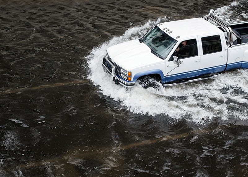 Policy objective- Enhancing resilience to flooding and other climate-related threats (car in water)