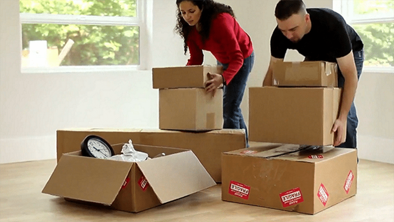 Increased voucher payment standards in high-cost areas (couple stacking moving boxes)