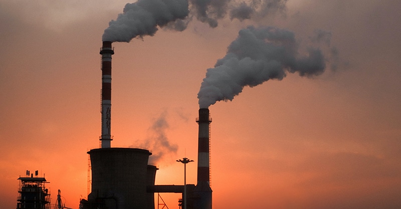 Policy objective- Reducing energy use and decreasing greenhouse gas emissions (factory emissions tower)