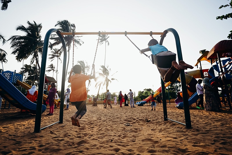 Policy objective- Strengthening communities through community development activities (kids on swingsets)