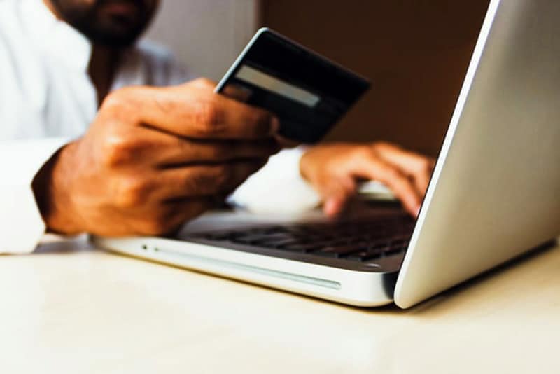 Source of income laws (women's hands on computer)