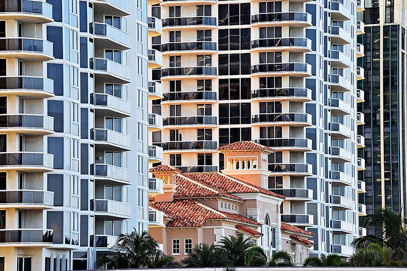 Balancing the preservation of existing affordable housing with new construction (church between apartment buildings)