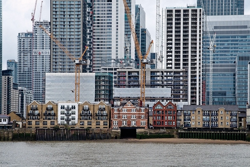 Gentrification (waterfront historic homes in front of skyscrapers)
