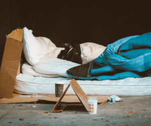 Homelessness person's bed is shown to illustrate homelessness and eviction prevention