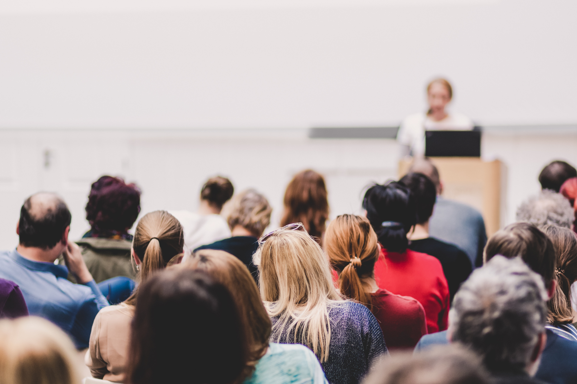 Image of people listening to a speaker